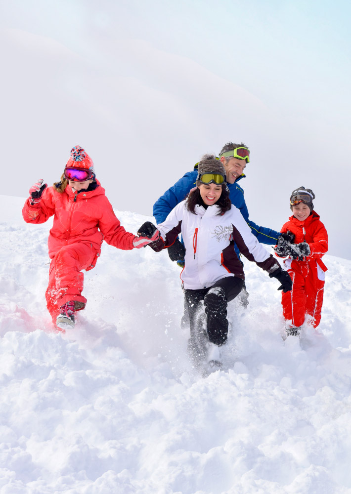 All the family is getting fun in the snow.