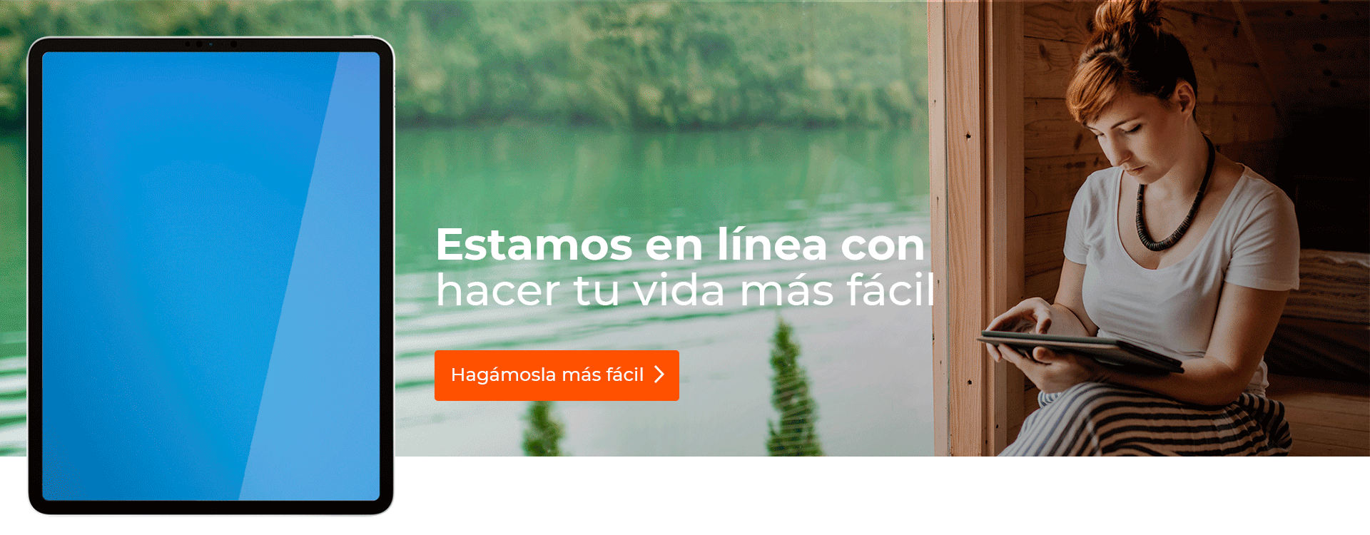 Mujer consultando su tableta al lado de un lago.