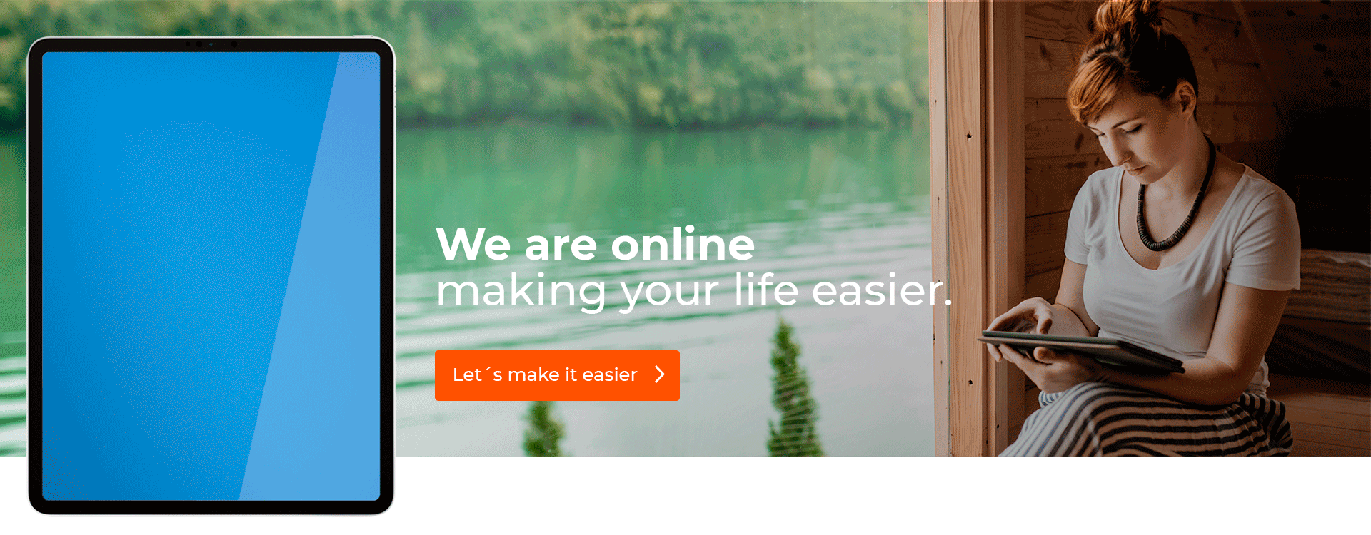 Women using her tablet near to a lake