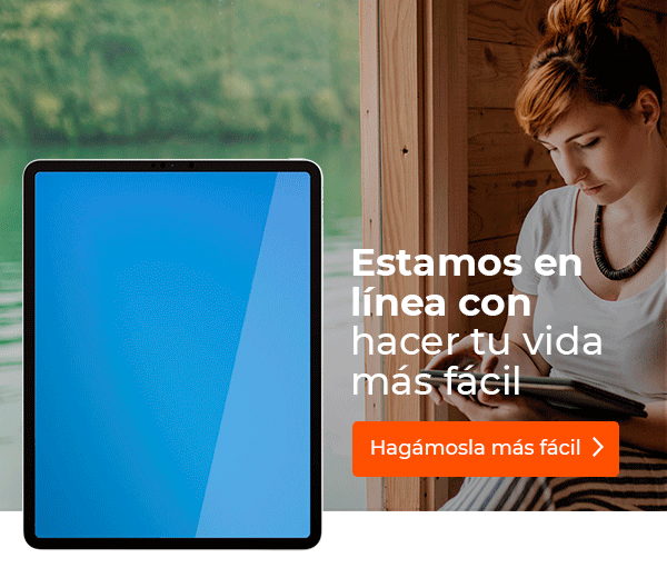 Mujer consultando su tableta al lado de un lago.