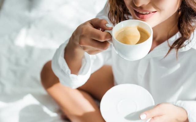 woman enjoying the benefits of coffee
